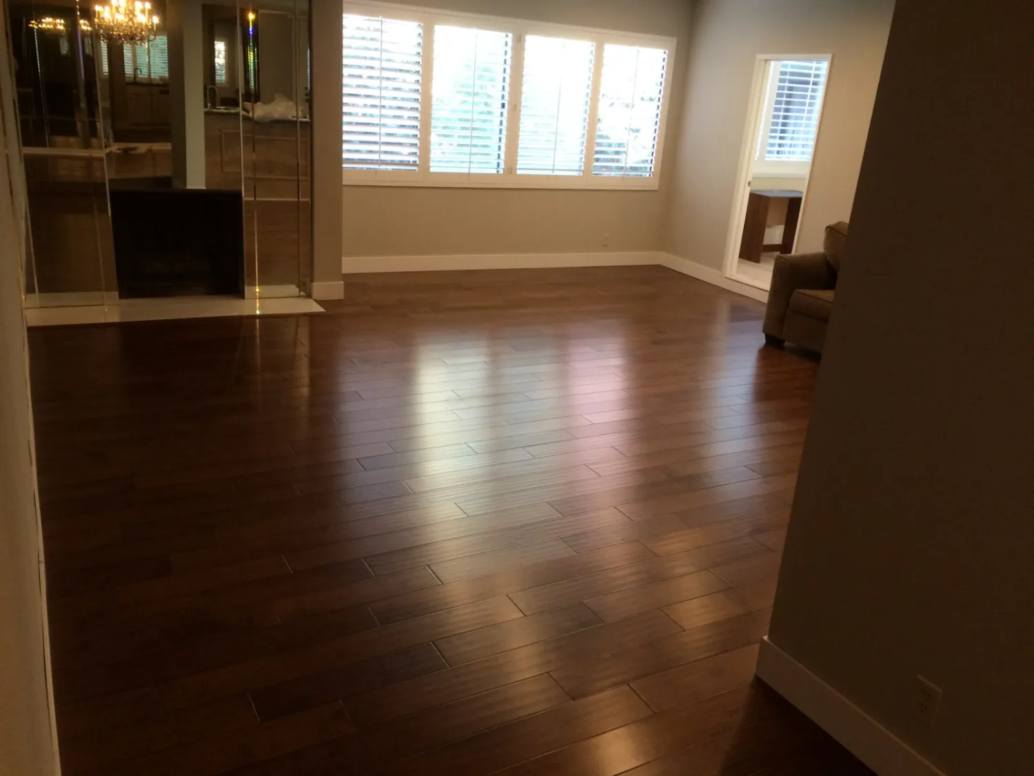 Dark hardwood flooring in a furnished living space