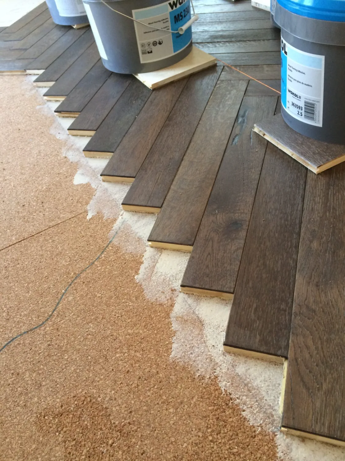 Engineered hardwood flooring during a glue-down installation