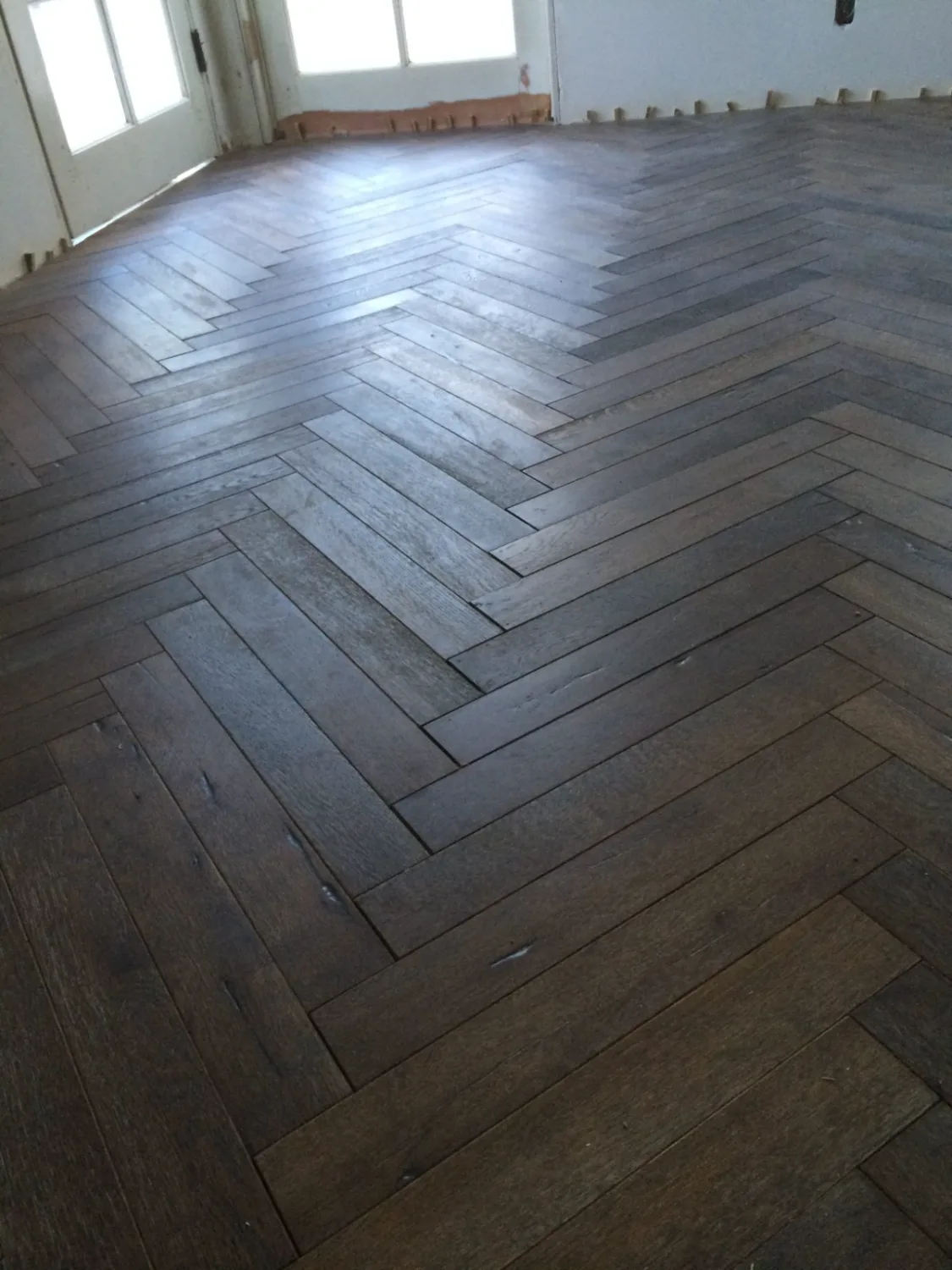 Herringbone hardwood flooring in a Los Angeles home