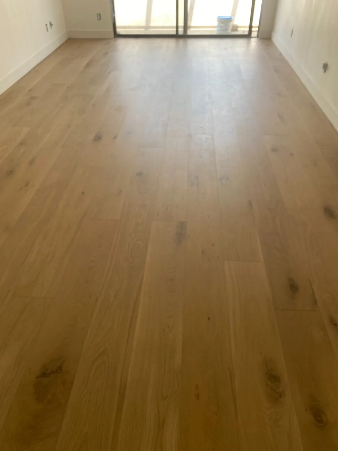 Natural oak hardwood flooring in an empty room