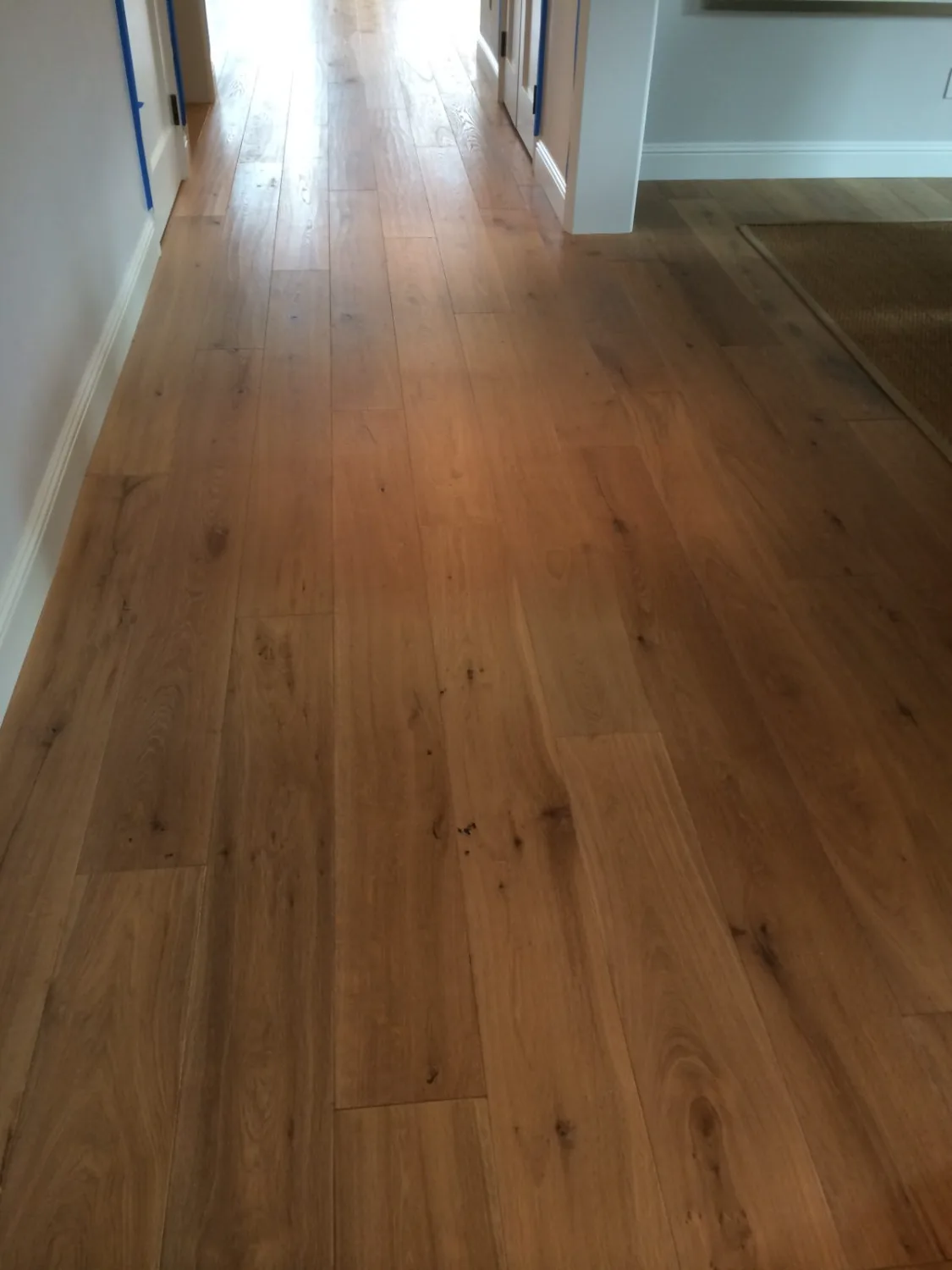 Natural oak hardwood flooring in a hallway