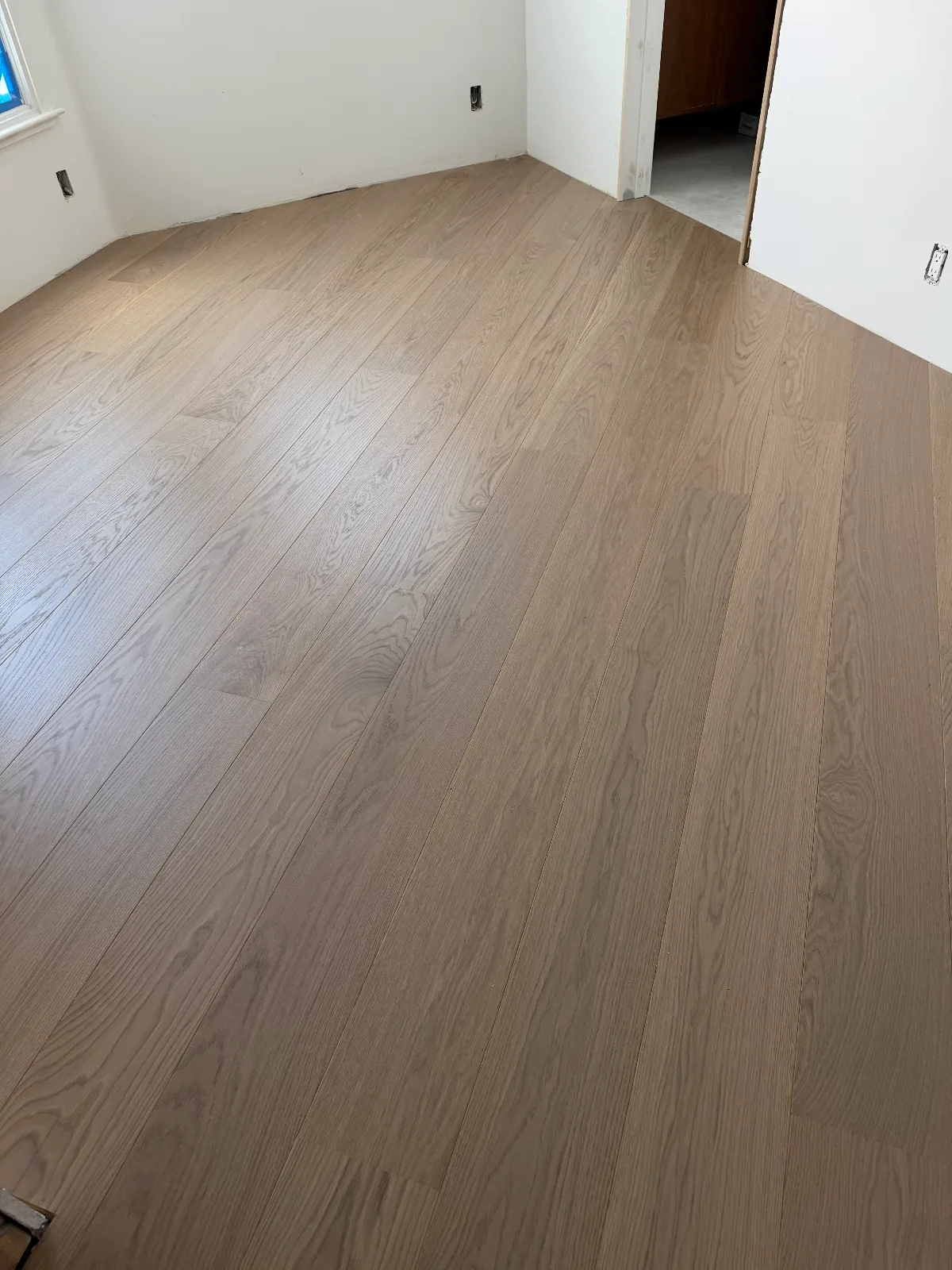 Smoked hardwood planks in a diagonal layout in Marina del Rey