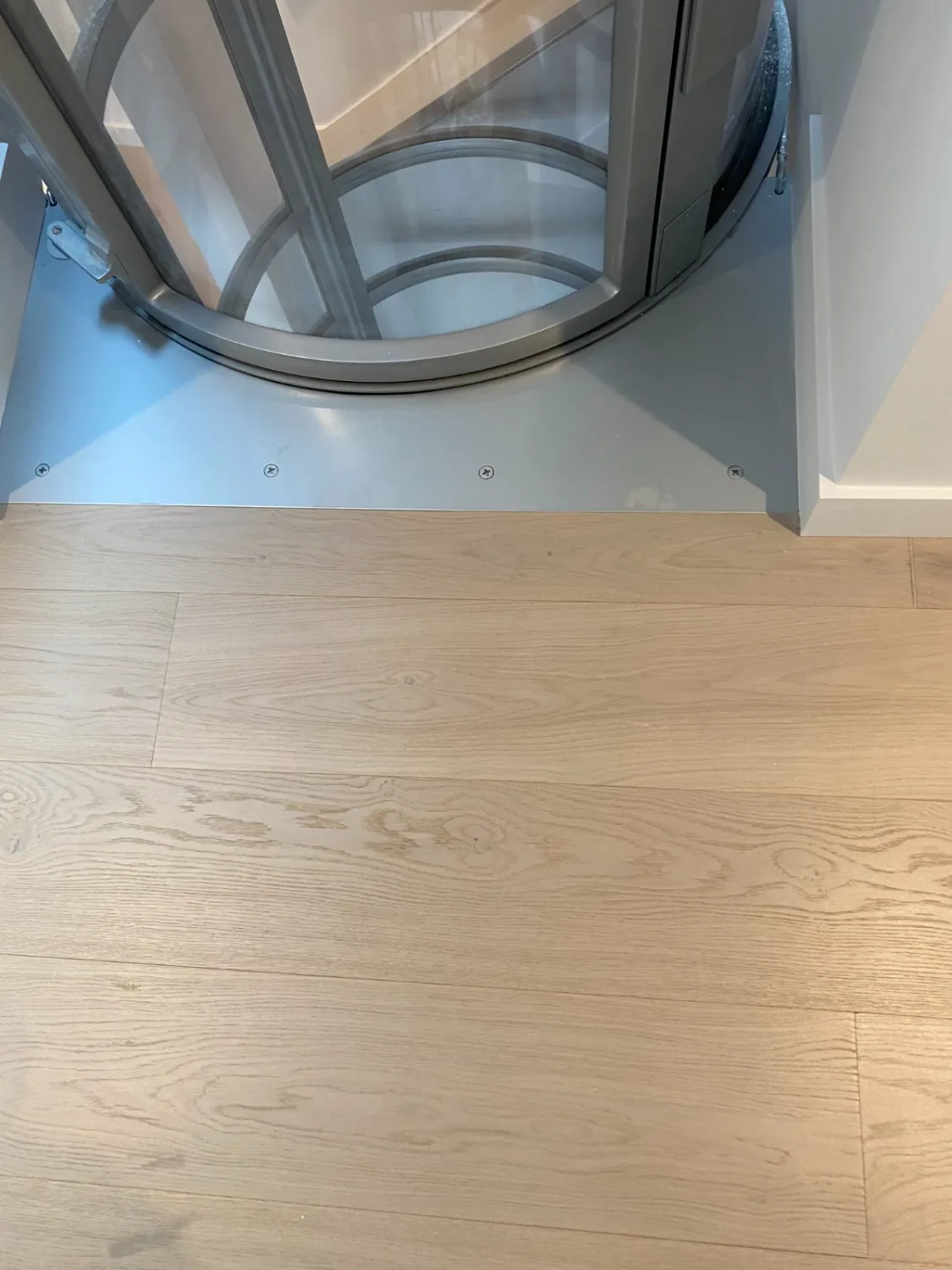 White oak hardwood flooring in a laundry area