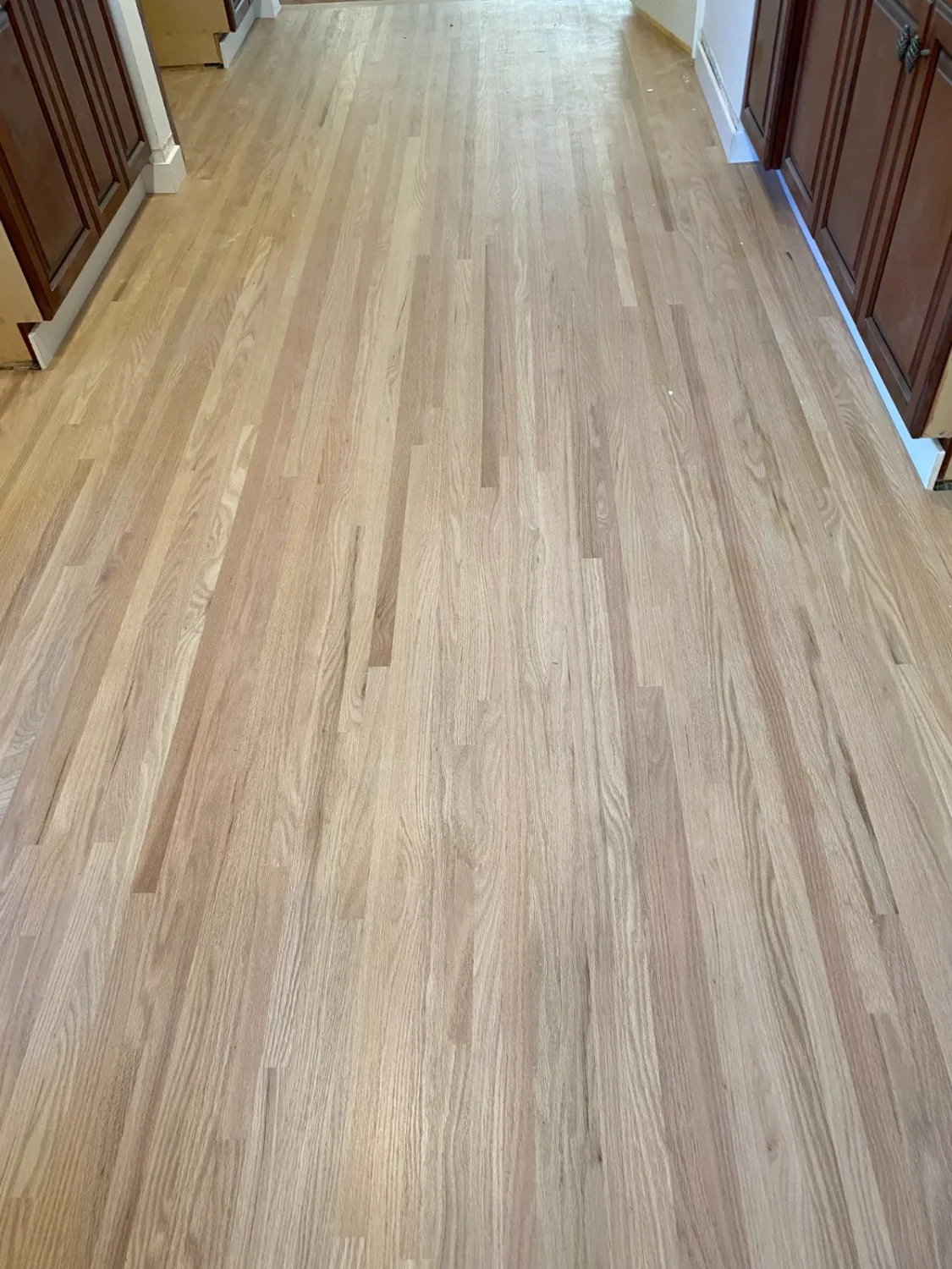 Whitewashed oak herringbone hardwood flooring