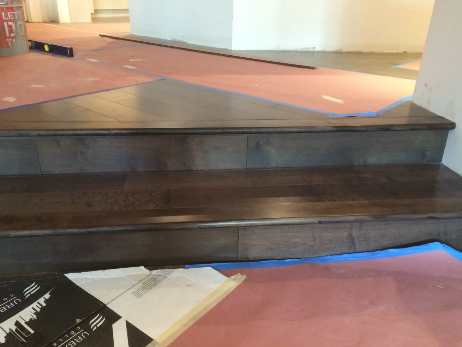 Dark hardwood step and landing during installation