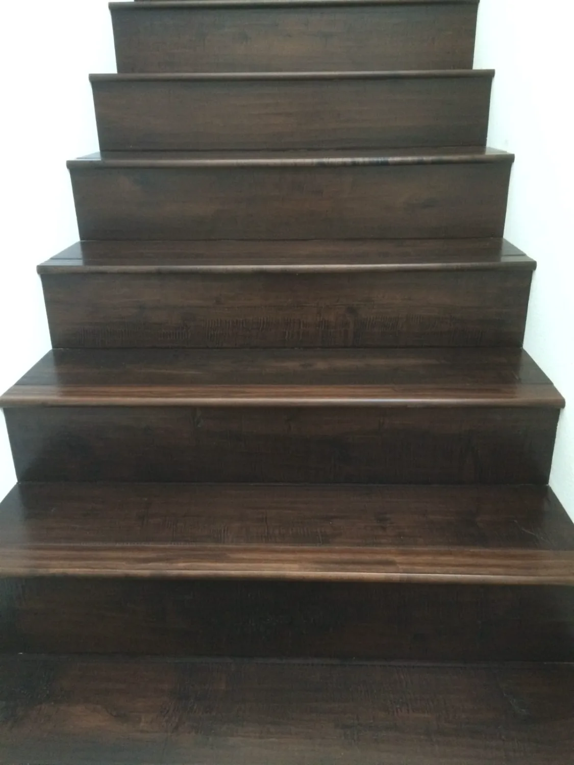 Espresso-stained hardwood stair treads and risers