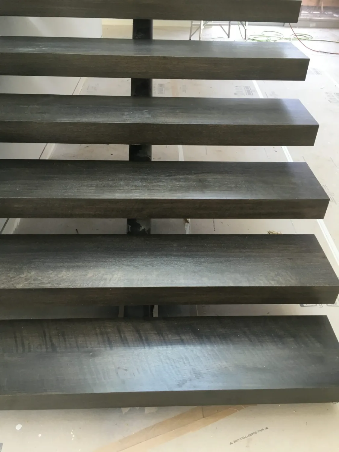 Close-up of floating gray hardwood stair treads