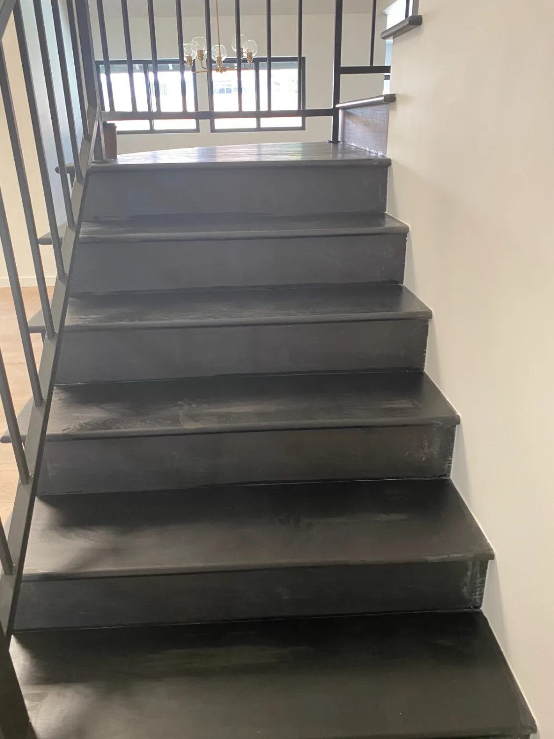 Gray-stained hardwood stair treads and risers