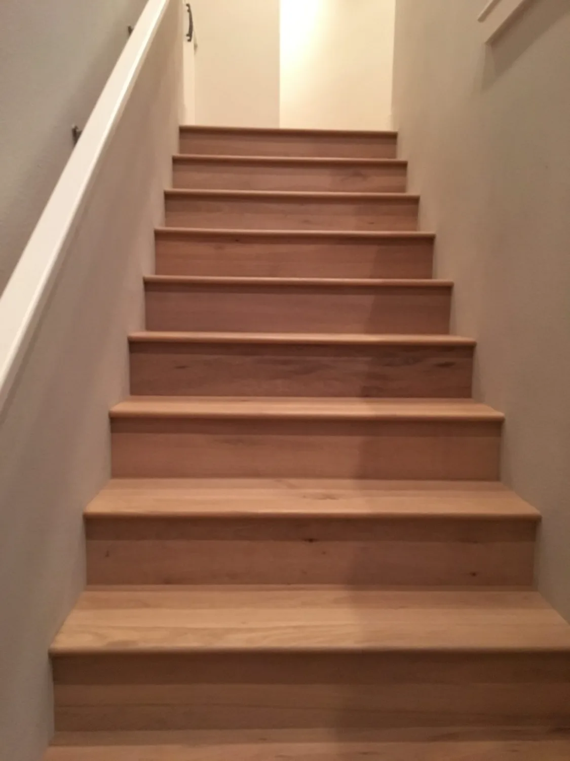 Straight flight of oak hardwood stair treads and risers