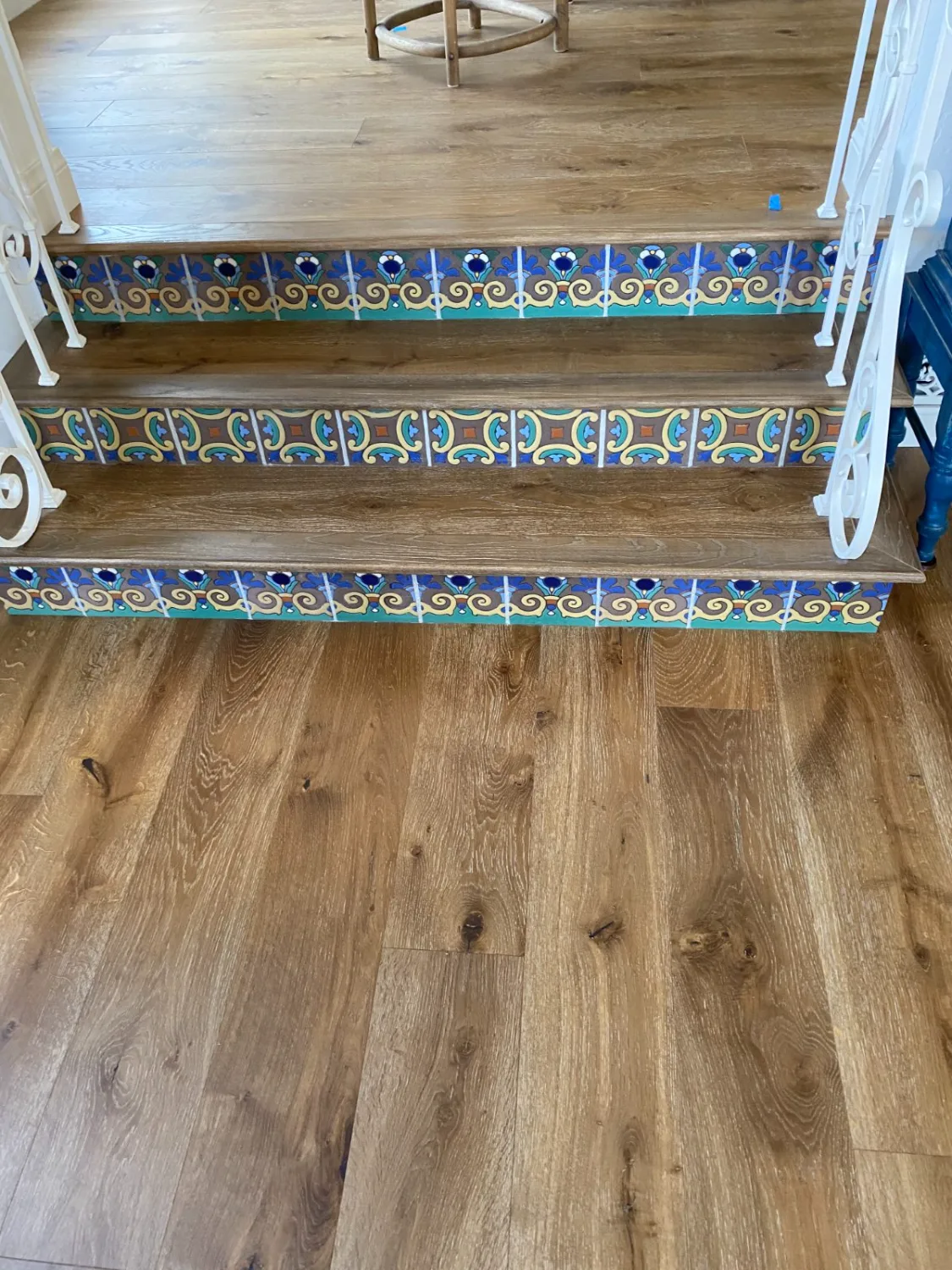 Oak hardwood stair treads and nosing with decorative tile risers