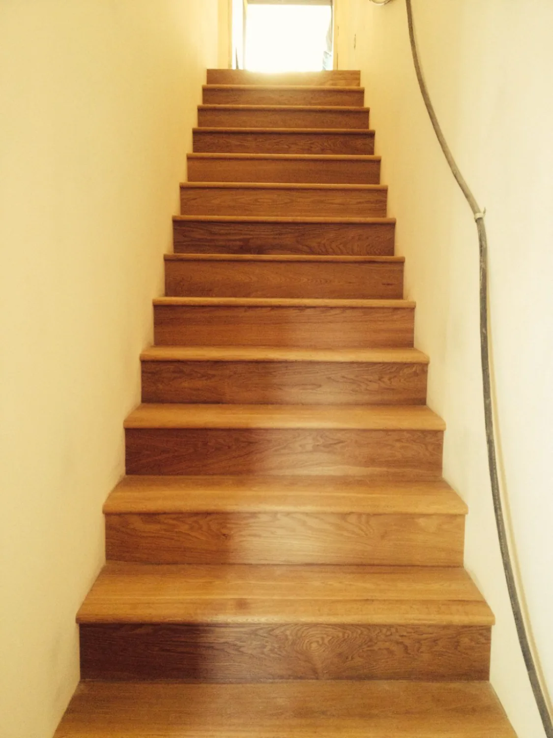 Oak hardwood stair treads and risers in a straight flight