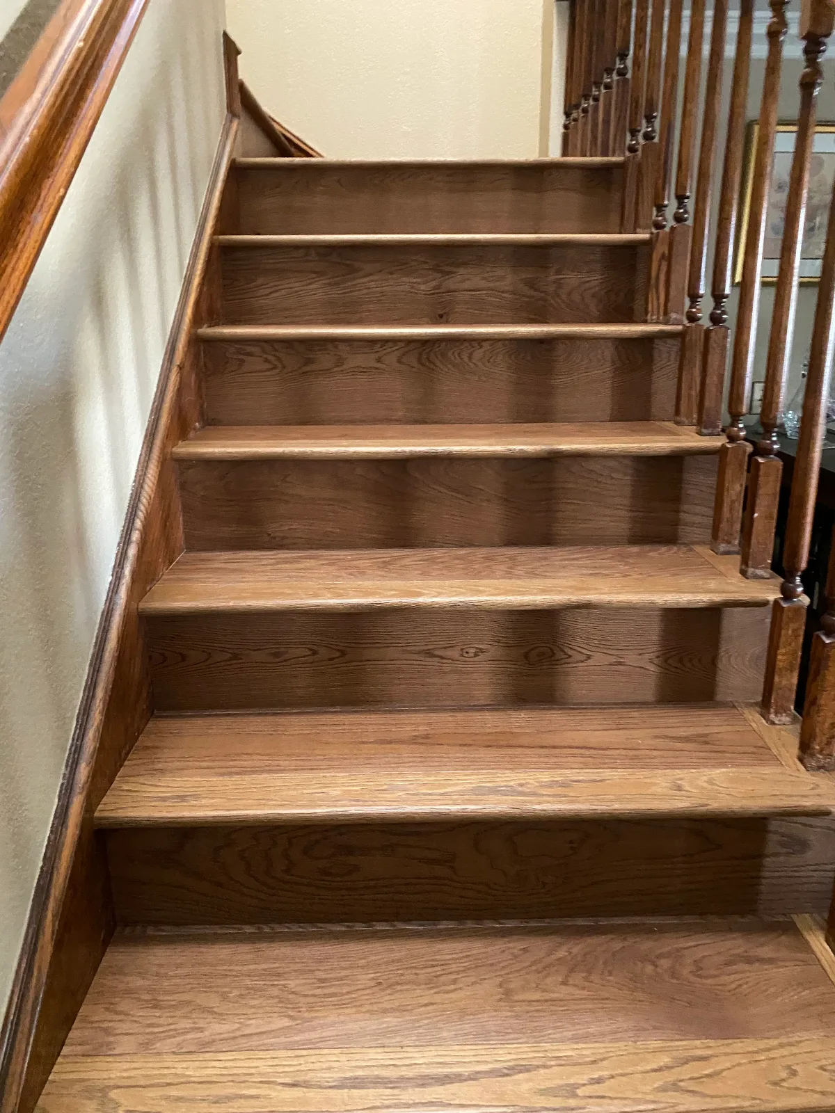 Red oak hardwood stair treads and risers stained to match the floor