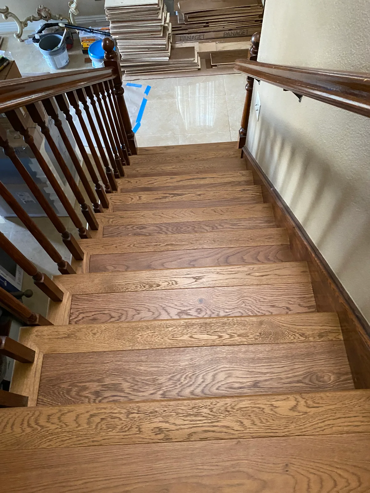 Red oak hardwood stair treads going in, with Panaget boxes on the landing