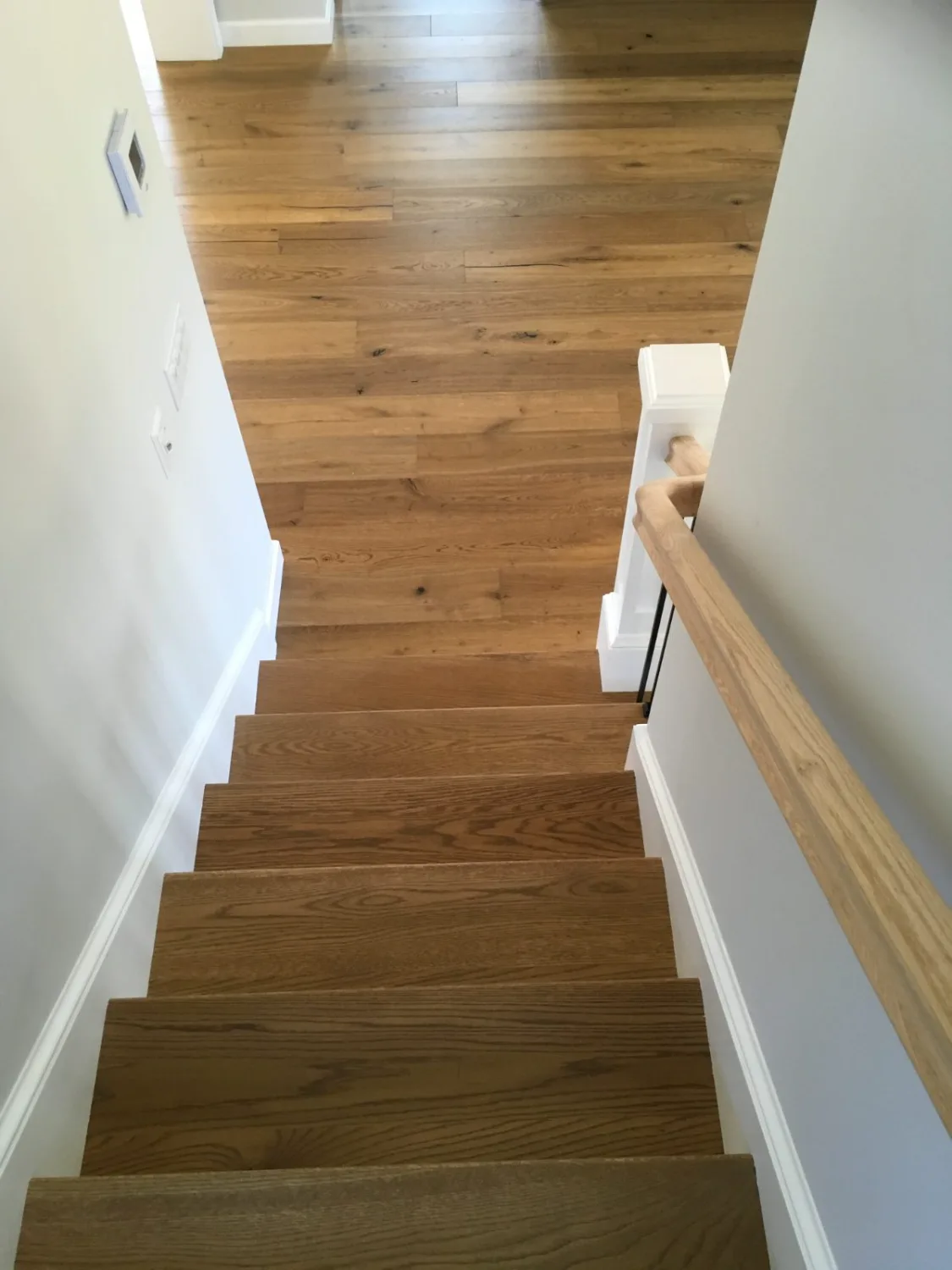 White oak hardwood stair treads, risers, and landing