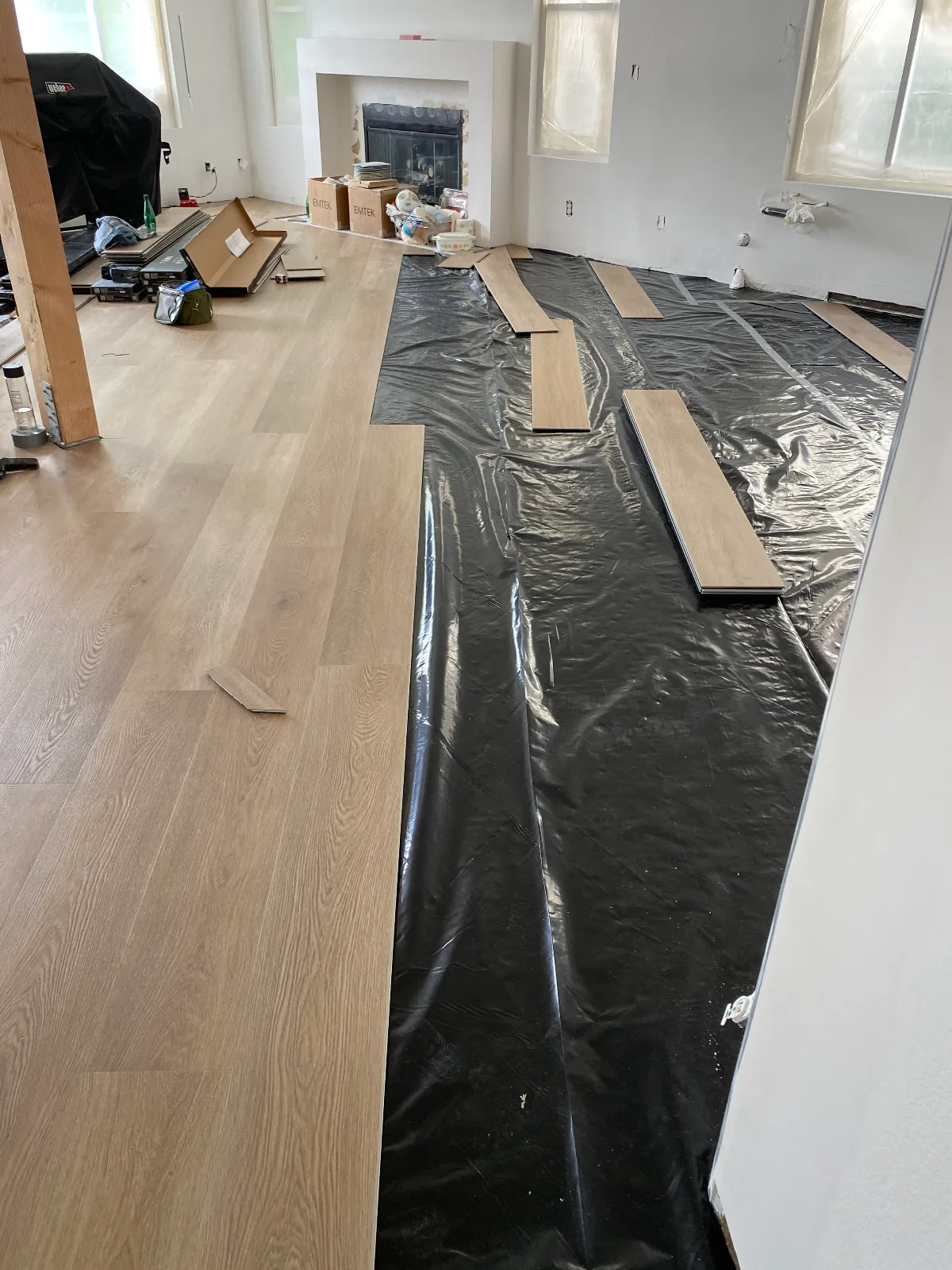 Moisture barrier laid over a prepared slab before Gaia Athena SPC vinyl plank
