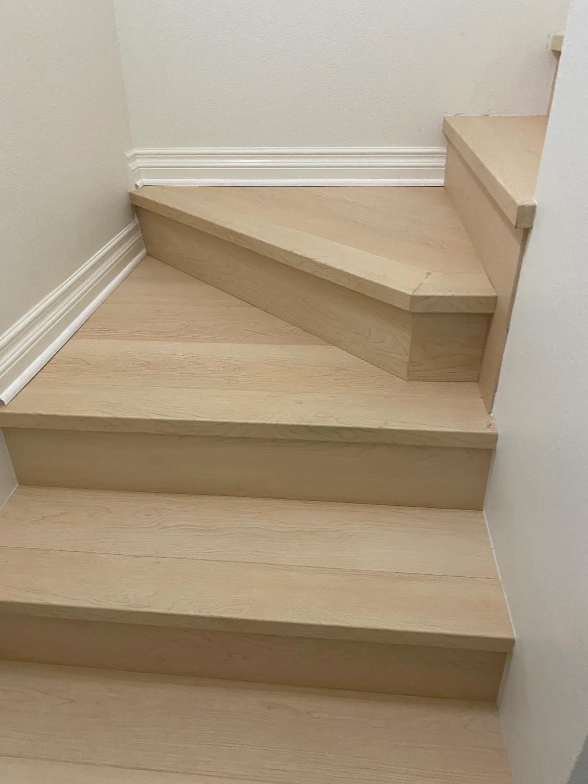 Nearwood Natura maple laminate staircase with a winder landing