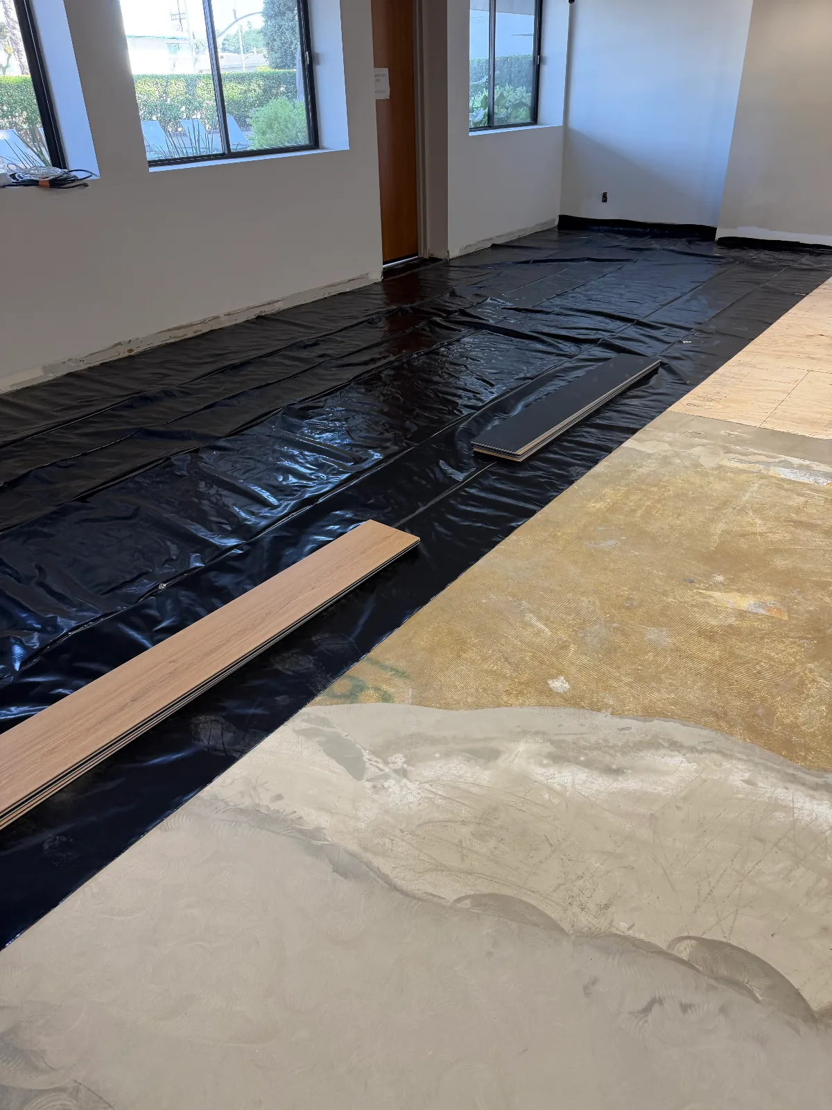 Moisture vapor barrier taped out before Gaia Riva SPC vinyl plank