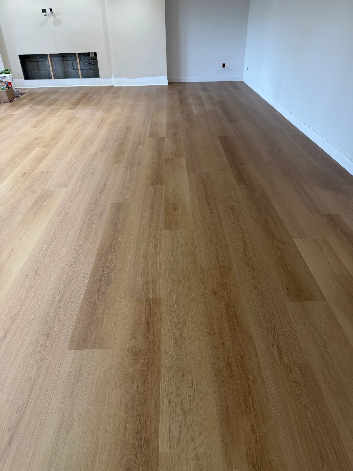 Gaia Riva SPC vinyl plank going down over a moisture barrier
