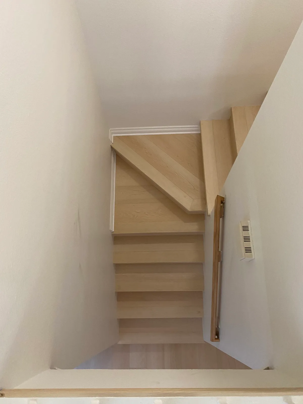 Natura maple laminate stair treads mid-installation
