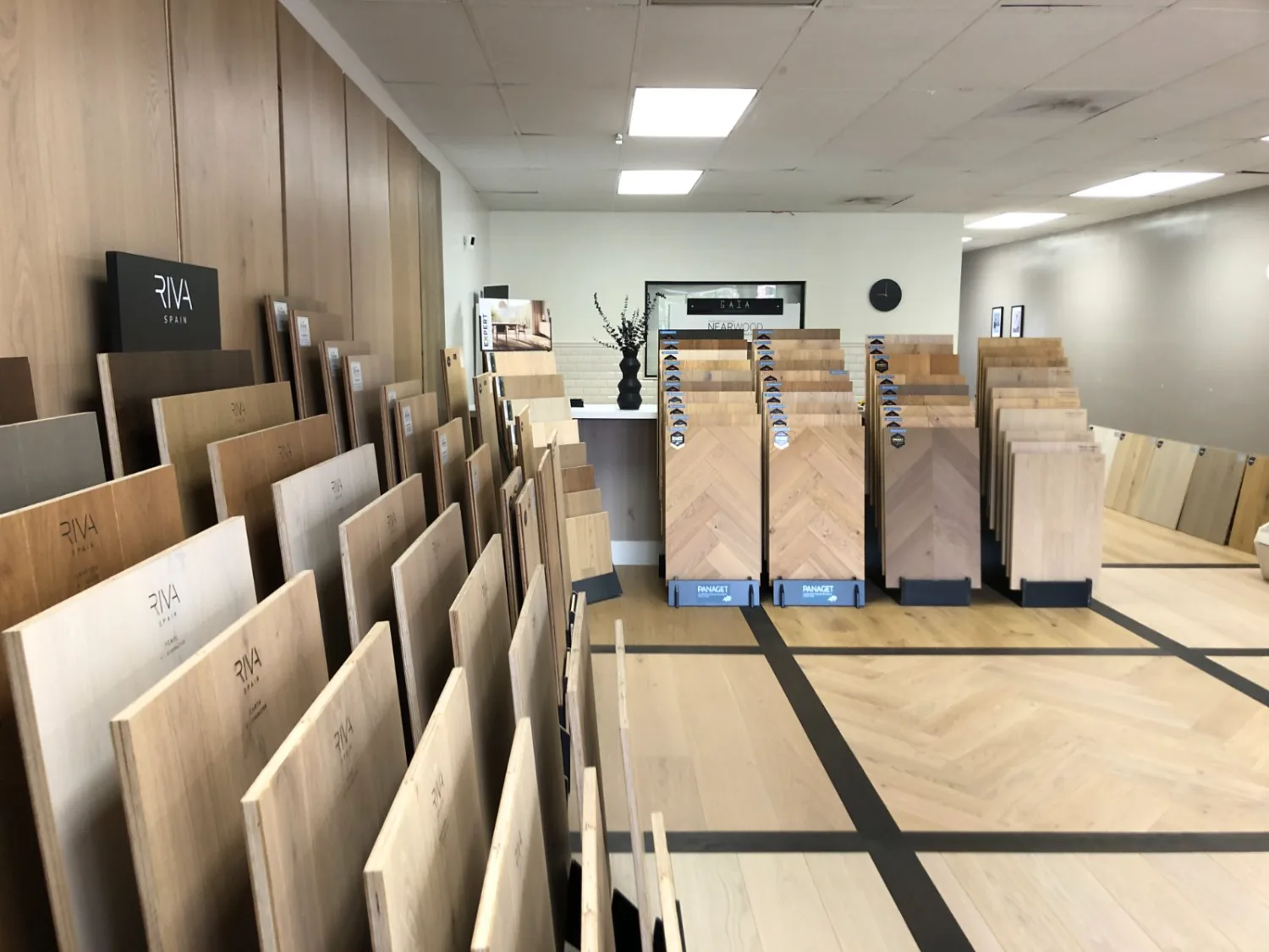 Aisle of hardwood flooring samples at the EKO FLOORING showroom in Agoura Hills